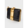 Black leather and gold metal clutch bag