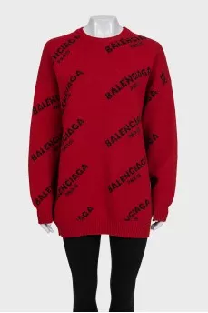 Червоний светр oversize крою у фірмовий принт