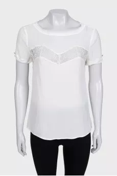 White blouse with short sleeves decorated with lace