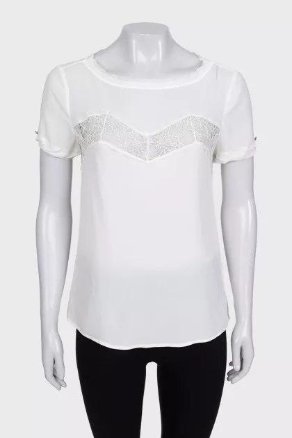 White blouse with short sleeves decorated with lace