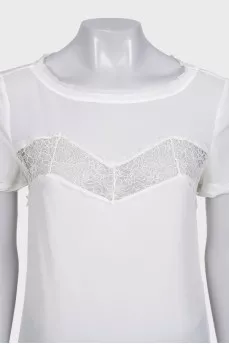 White blouse with short sleeves decorated with lace