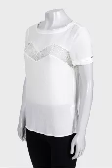 White blouse with short sleeves decorated with lace