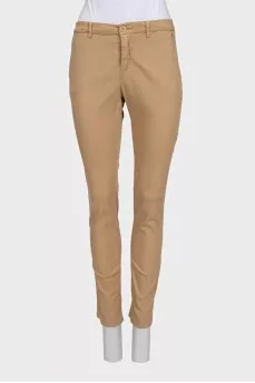Beige tapered trousers with a mid-rise