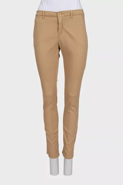 Beige tapered trousers with a mid-rise