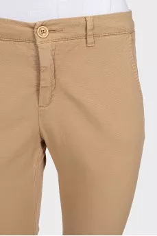 Beige tapered trousers with a mid-rise
