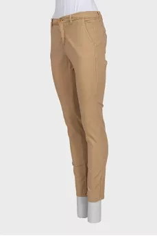 Beige tapered trousers with a mid-rise