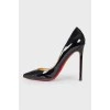 Black varnished stilettos, with red sole