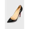 Black varnished stilettos, with red sole