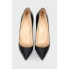 Black varnished stilettos, with red sole