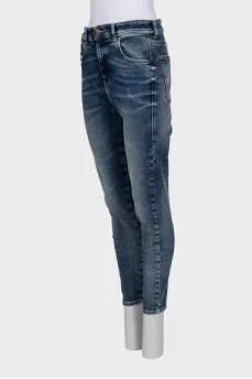 Blue skinny fit jeans with a distressed effect