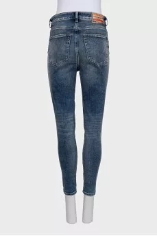 Blue skinny fit jeans with a distressed effect