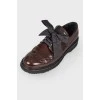 Brown leather brogs on rubber sole