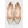 Golden stiletto heels