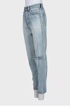 Light blue straight-leg jeans with a ripped effect