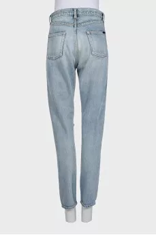 Light blue straight-leg jeans with a ripped effect
