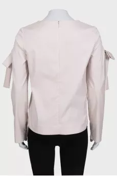 Straight cut blouse decorated with bows