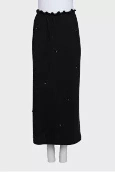 Black fitted skirt decorated with starbursts