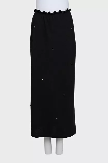 Black fitted skirt decorated with starbursts