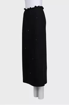 Black fitted skirt decorated with starbursts