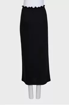 Black fitted skirt decorated with starbursts