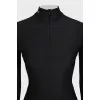 Black turtleneck with a 3D pattern and tag