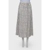 White skirt embellished with black stars, laced up
