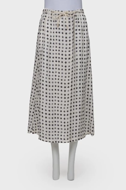 White skirt embellished with black stars, laced up