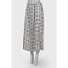 White skirt embellished with black stars, laced up