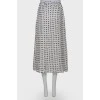 White skirt embellished with black stars, laced up