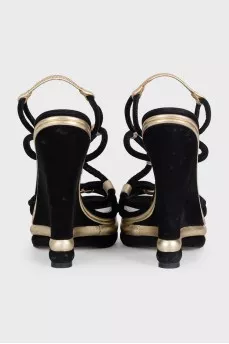 Black suede sandals with gold trim