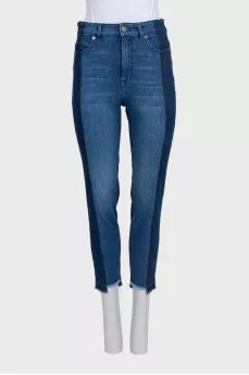 Blue jeans with contrast seams and raw hem