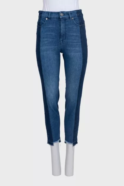 Blue jeans with contrast seams and raw hem