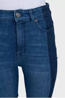 Blue jeans with contrast seams and raw hem