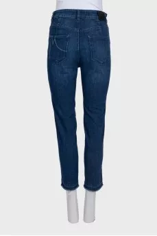 Blue jeans with contrast seams and raw hem