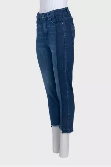 Blue jeans with contrast seams and raw hem