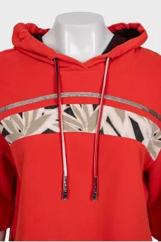 Cropped orange hoodie decorated with sequins