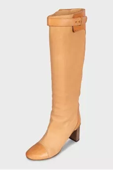 Beige leather boots with a heel