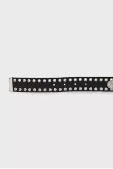 Leather belt decorated with eyelets and crystals