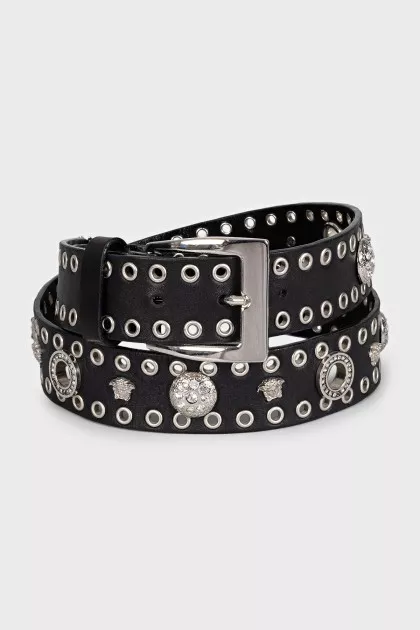 Leather belt decorated with eyelets and crystals