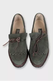 Green suede loafers with tassels
