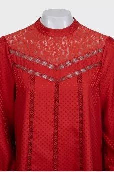 Red dress with long sleeves decorated with perforations