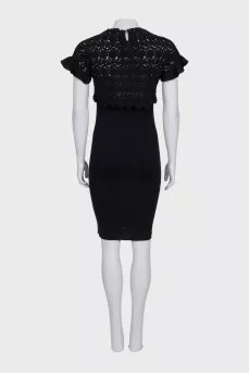 Black fitted dress with a bow and tag