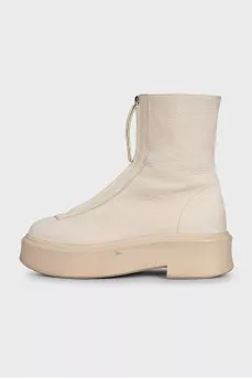 Beige leather boots with a zipper