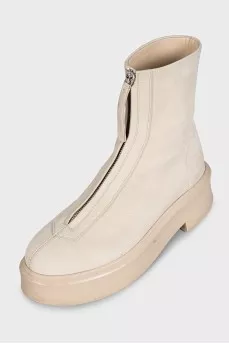 Beige leather boots with a zipper