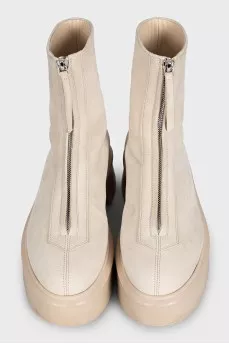 Beige leather boots with a zipper