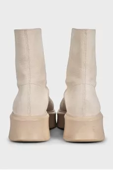 Beige leather boots with a zipper
