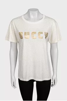 Beige T-shirt with a gold logo