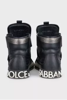Black high-top sneakers made of leather and suede