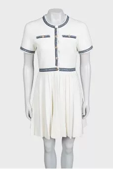 White dress with blue embroidery and tag