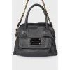 Leather bag with a brand's logo